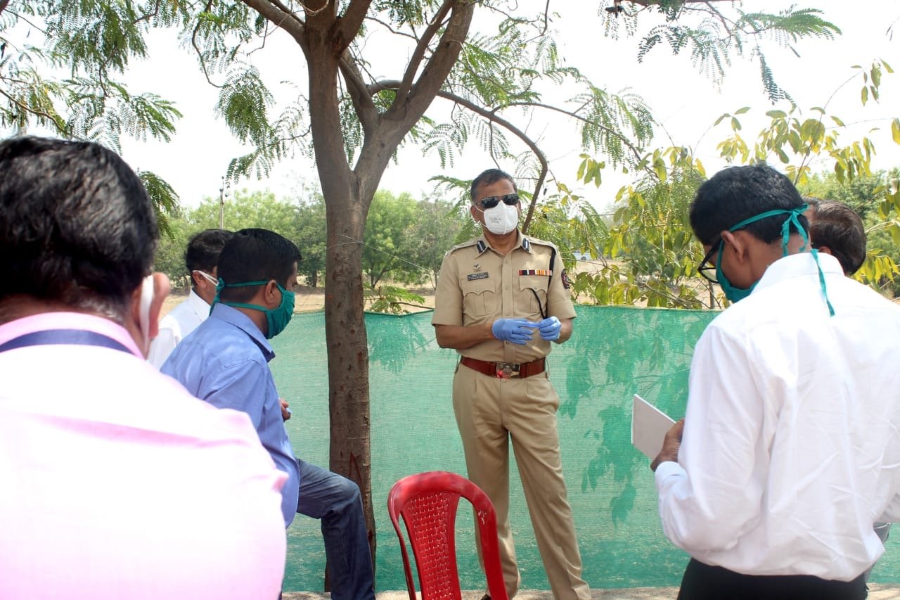 Police personnel receiving public safety guidance during the pandemic